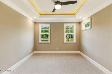 This brand new Riptide home with stunning setting and finishes on Sea Trail Golf Resort in North Carolina - for sale on GolfHomes.com, golf home, golf lot