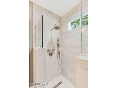 This brand new Riptide home with stunning setting and finishes on Sea Trail Golf Resort in North Carolina - for sale on GolfHomes.com, golf home, golf lot