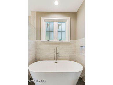 This brand new Riptide home with stunning setting and finishes on Sea Trail Golf Resort in North Carolina - for sale on GolfHomes.com, golf home, golf lot