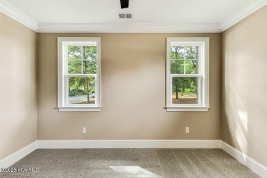 This brand new Riptide home with stunning setting and finishes on Sea Trail Golf Resort in North Carolina - for sale on GolfHomes.com, golf home, golf lot