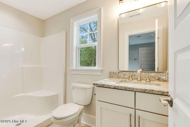 This brand new Riptide home with stunning setting and finishes on Sea Trail Golf Resort in North Carolina - for sale on GolfHomes.com, golf home, golf lot