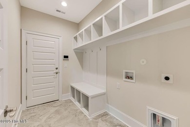 This brand new Riptide home with stunning setting and finishes on Sea Trail Golf Resort in North Carolina - for sale on GolfHomes.com, golf home, golf lot