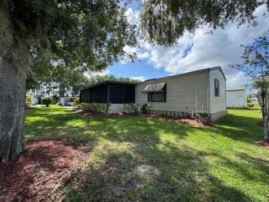 There is tons of space inside & out in this 2/2 sanctuary! It is on Lake Henry Golf Club in Florida - for sale on GolfHomes.com, golf home, golf lot