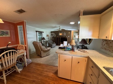 There is tons of space inside & out in this 2/2 sanctuary! It is on Lake Henry Golf Club in Florida - for sale on GolfHomes.com, golf home, golf lot
