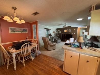 There is tons of space inside & out in this 2/2 sanctuary! It is on Lake Henry Golf Club in Florida - for sale on GolfHomes.com, golf home, golf lot