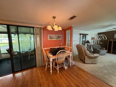 There is tons of space inside & out in this 2/2 sanctuary! It is on Lake Henry Golf Club in Florida - for sale on GolfHomes.com, golf home, golf lot