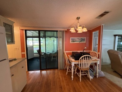 There is tons of space inside & out in this 2/2 sanctuary! It is on Lake Henry Golf Club in Florida - for sale on GolfHomes.com, golf home, golf lot