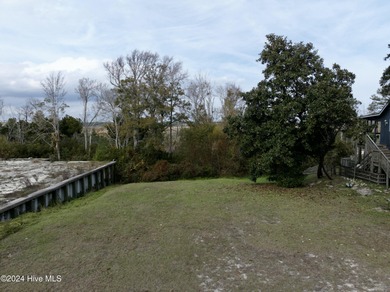 Build your beach house on this lovely lot with marsh views and on Oak Island Golf Club in North Carolina - for sale on GolfHomes.com, golf home, golf lot