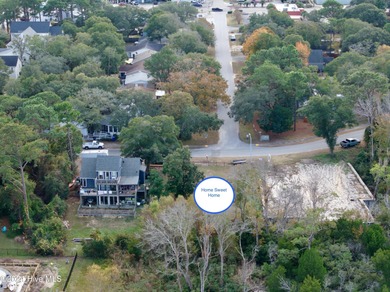 Build your beach house on this lovely lot with marsh views and on Oak Island Golf Club in North Carolina - for sale on GolfHomes.com, golf home, golf lot