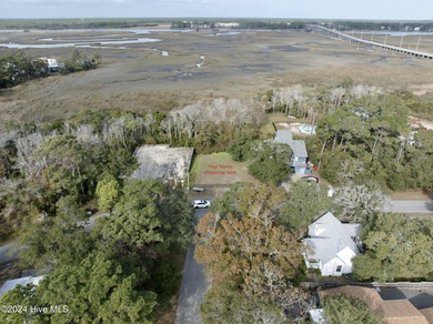 Build your beach house on this lovely lot with marsh views and on Oak Island Golf Club in North Carolina - for sale on GolfHomes.com, golf home, golf lot