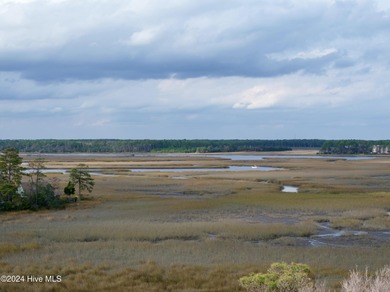 Build your beach house on this lovely lot with marsh views and on Oak Island Golf Club in North Carolina - for sale on GolfHomes.com, golf home, golf lot