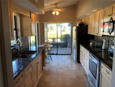 This beautifully renovated two bedroom, two bathroom villa with on Plantation Golf and Country Club in Florida - for sale on GolfHomes.com, golf home, golf lot