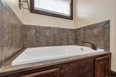 Stunning updated executive home with sunroom and screened porch on Sage Meadows Golf Course in Arkansas - for sale on GolfHomes.com, golf home, golf lot