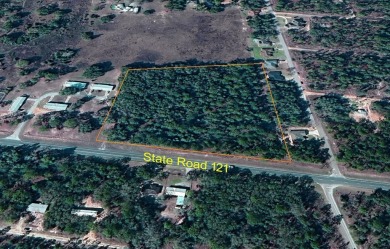 OVER 6.5 ACRES ON STATE ROAD 121! Check out this 6.69 acres with on Williston Highlands Golf and Country Club in Florida - for sale on GolfHomes.com, golf home, golf lot