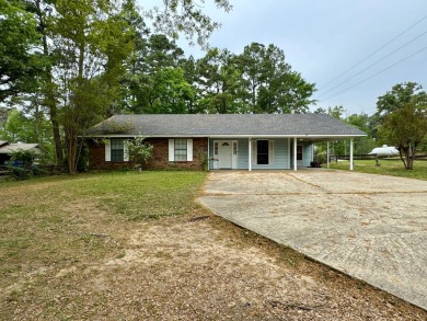 This charming brick home is nestled on 1 acre in a peaceful area on Cypress Bend Golf Resort in Louisiana - for sale on GolfHomes.com, golf home, golf lot