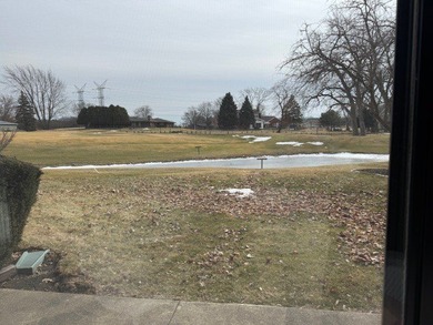 This rare first-floor 2-bedroom, 2-bath condo offers one of the on Oak Hills Country Club in Illinois - for sale on GolfHomes.com, golf home, golf lot