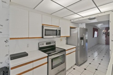 Beautiful views of golf course, this 2 bedroom/2 bath unit has on Flamingo Lakes Country Club in Florida - for sale on GolfHomes.com, golf home, golf lot