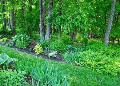 This custom-built, 5 BD/3 BA brick rambler is a rare find on Spring Valley Golf Course in Wisconsin - for sale on GolfHomes.com, golf home, golf lot