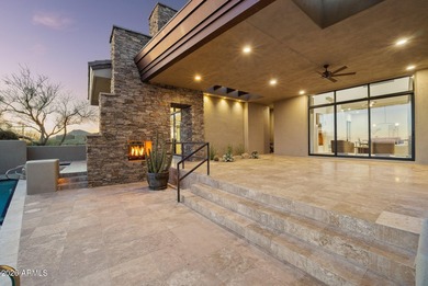 Framed by sweeping views of Pinnacle Peak and city lights, this on Desert Mountain Golf Club - Renegade Course in Arizona - for sale on GolfHomes.com, golf home, golf lot