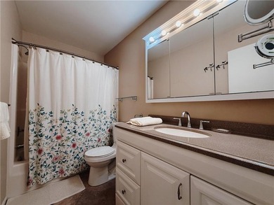 Golf + water views from this completely redone, fully furnished on The American Golf Club in Florida - for sale on GolfHomes.com, golf home, golf lot