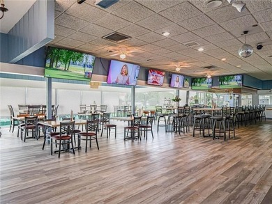 Golf + water views from this completely redone, fully furnished on The American Golf Club in Florida - for sale on GolfHomes.com, golf home, golf lot