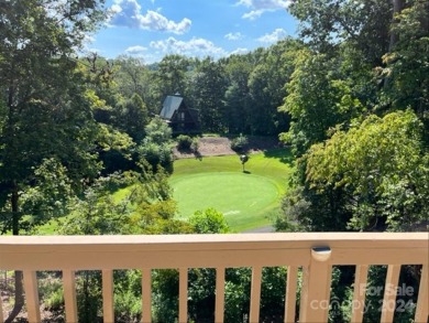 Nicely updated home, overlooking the 11th green of the Bald on Rumbling Bald Resort on Lake Lure in North Carolina - for sale on GolfHomes.com, golf home, golf lot