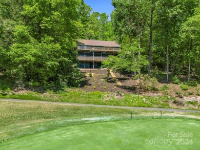 Nicely updated home, overlooking the 11th green of the Bald on Rumbling Bald Resort on Lake Lure in North Carolina - for sale on GolfHomes.com, golf home, golf lot