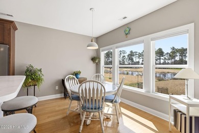 It is all about the view! This charming 3BR/2BA home has an on Carolina National Golf Club in North Carolina - for sale on GolfHomes.com, golf home, golf lot