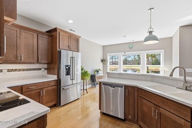 It is all about the view! This charming 3BR/2BA home has an on Carolina National Golf Club in North Carolina - for sale on GolfHomes.com, golf home, golf lot