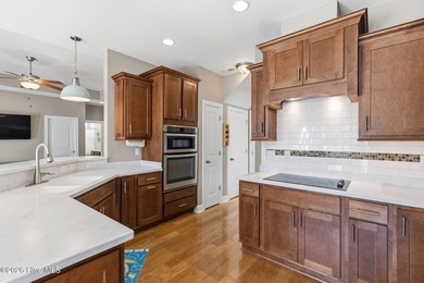 It is all about the view! This charming 3BR/2BA home has an on Carolina National Golf Club in North Carolina - for sale on GolfHomes.com, golf home, golf lot