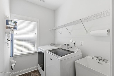 It is all about the view! This charming 3BR/2BA home has an on Carolina National Golf Club in North Carolina - for sale on GolfHomes.com, golf home, golf lot