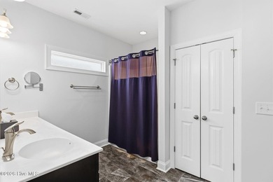 It is all about the view! This charming 3BR/2BA home has an on Carolina National Golf Club in North Carolina - for sale on GolfHomes.com, golf home, golf lot