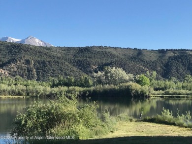 Rarely available and highly desirable ground floor pondside on Ranch at Roaring Fork Golf Course in Colorado - for sale on GolfHomes.com, golf home, golf lot