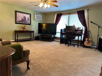 Welcome to 350 Lake Hill Drive! This 4-bed, 2-bath split-foyer on Worthington Country Club in Minnesota - for sale on GolfHomes.com, golf home, golf lot