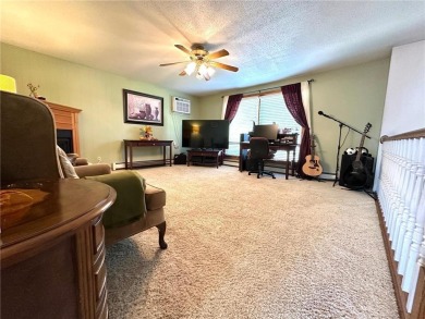 Welcome to 350 Lake Hill Drive! This 4-bed, 2-bath split-foyer on Worthington Country Club in Minnesota - for sale on GolfHomes.com, golf home, golf lot