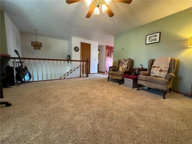 Welcome to 350 Lake Hill Drive! This 4-bed, 2-bath split-foyer on Worthington Country Club in Minnesota - for sale on GolfHomes.com, golf home, golf lot