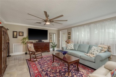 Live the Dunedin dream from this beautifully renovated on The Dunedin Country Club in Florida - for sale on GolfHomes.com, golf home, golf lot