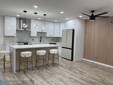 A stunning modern redesigned condo showcases impeccable on Wynmoor Golf Course in Florida - for sale on GolfHomes.com, golf home, golf lot