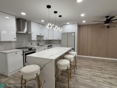 A stunning modern redesigned condo showcases impeccable on Wynmoor Golf Course in Florida - for sale on GolfHomes.com, golf home, golf lot