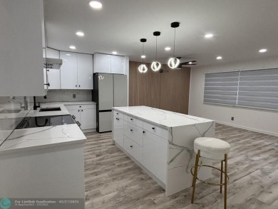 A stunning modern redesigned condo showcases impeccable on Wynmoor Golf Course in Florida - for sale on GolfHomes.com, golf home, golf lot