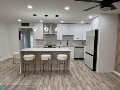 A stunning modern redesigned condo showcases impeccable on Wynmoor Golf Course in Florida - for sale on GolfHomes.com, golf home, golf lot