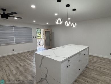 A stunning modern redesigned condo showcases impeccable on Wynmoor Golf Course in Florida - for sale on GolfHomes.com, golf home, golf lot