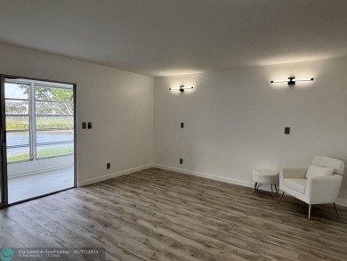 A stunning modern redesigned condo showcases impeccable on Wynmoor Golf Course in Florida - for sale on GolfHomes.com, golf home, golf lot