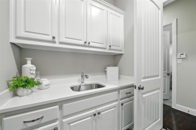 Backed by sweeping golf course views and designed with both on Lantana Golf Club in Texas - for sale on GolfHomes.com, golf home, golf lot