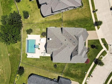 Backed by sweeping golf course views and designed with both on Lantana Golf Club in Texas - for sale on GolfHomes.com, golf home, golf lot