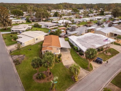 WATERFRONT 2 BED/2 BATH CORNER LOT - BOATHOUSE w/ LIFT - VIBRANT on Bay Tree Golf Course in Florida - for sale on GolfHomes.com, golf home, golf lot