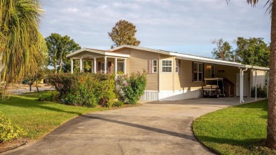 WATERFRONT 2 BED/2 BATH CORNER LOT - BOATHOUSE w/ LIFT - VIBRANT on Bay Tree Golf Course in Florida - for sale on GolfHomes.com, golf home, golf lot