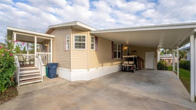 WATERFRONT 2 BED/2 BATH CORNER LOT - BOATHOUSE w/ LIFT - VIBRANT on Bay Tree Golf Course in Florida - for sale on GolfHomes.com, golf home, golf lot