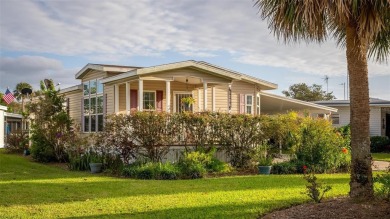 WATERFRONT 2 BED/2 BATH CORNER LOT - BOATHOUSE w/ LIFT - VIBRANT on Bay Tree Golf Course in Florida - for sale on GolfHomes.com, golf home, golf lot