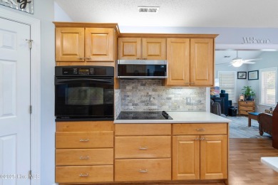 Discover this stunning brick home on just under half an acre on Carolina Shores Golf Course in North Carolina - for sale on GolfHomes.com, golf home, golf lot